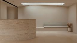 Solstice med spa reception with travertine desk and soft natural light