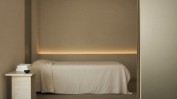 Solstice med spa treatment room in cream linen and warm light
