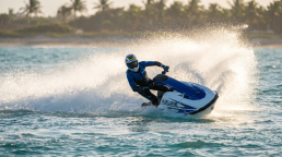 Rider carving a turn on an Azure jetski